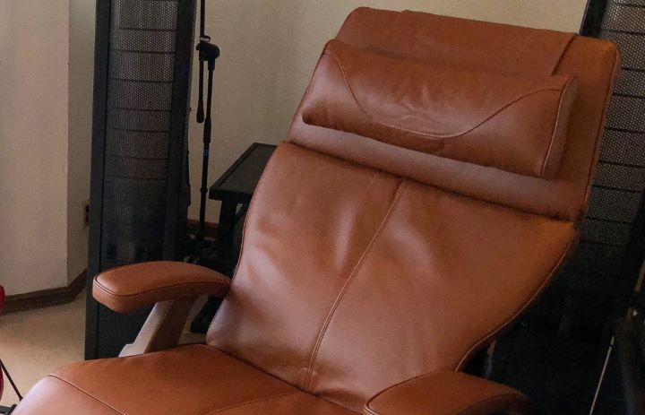 Confirming how perfectly comfortable and supportive the headrest of the Human Touch leather recliner